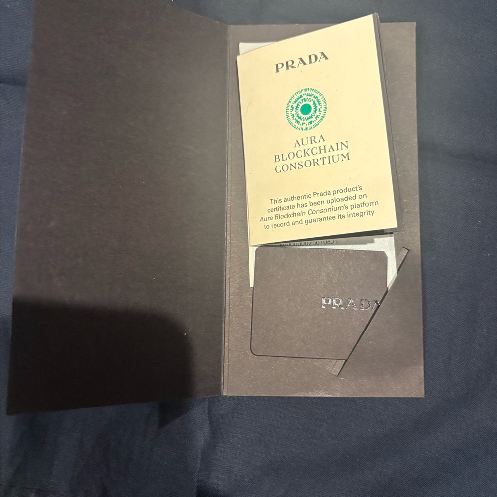 Prada large tote. Authentic.  Comes with registration and receipt.   Never used.